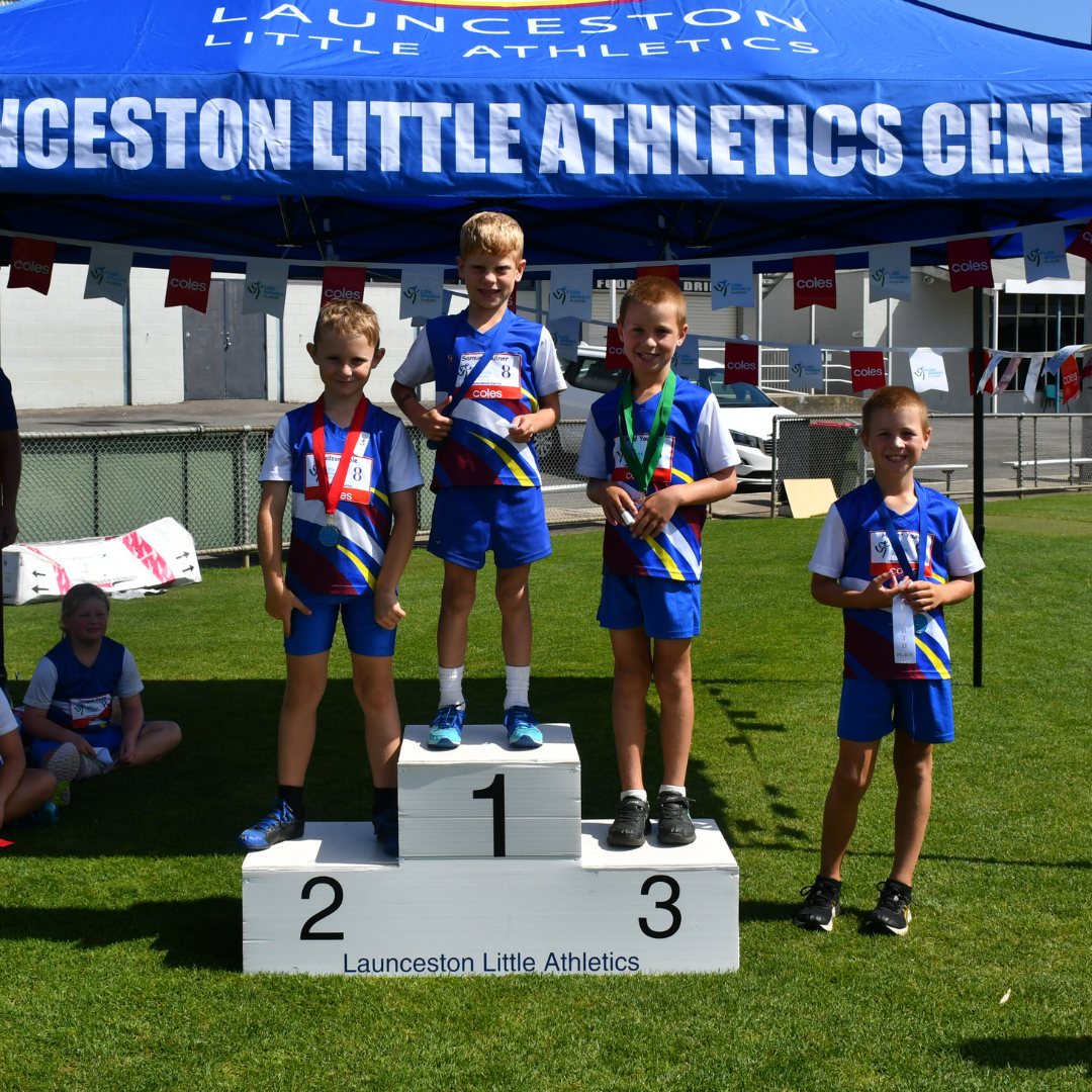 Age group winners on the podium with medals