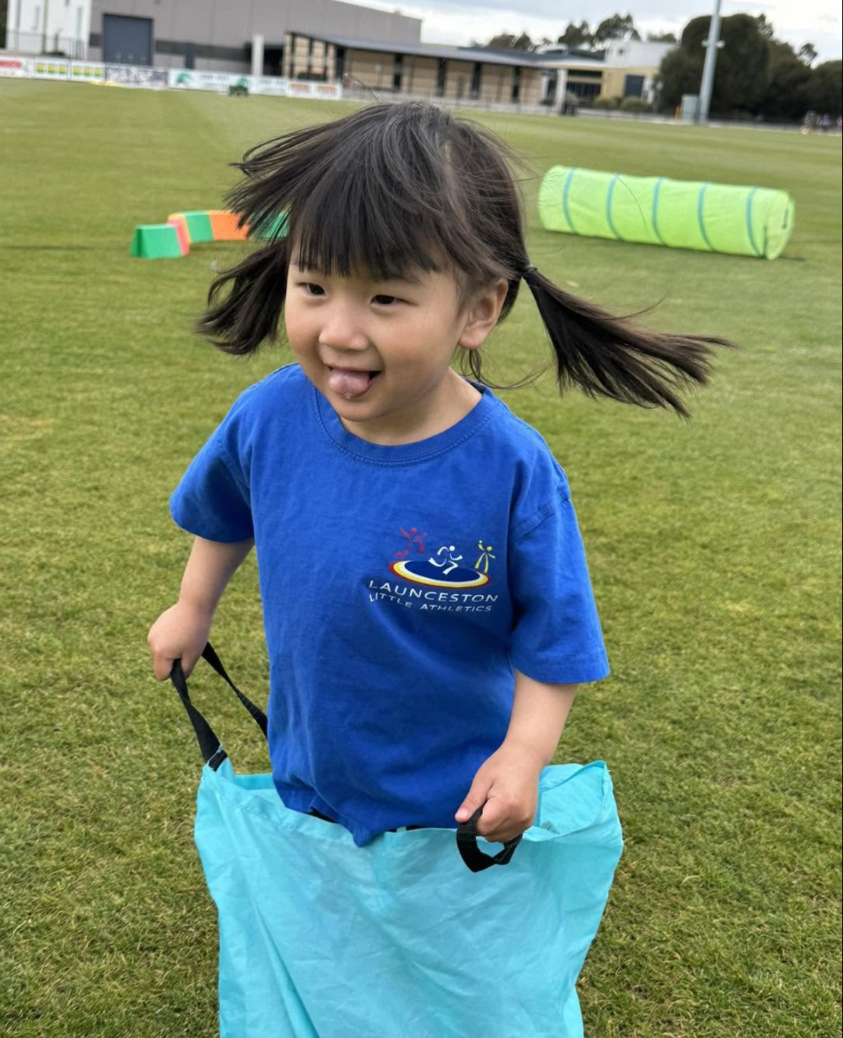 Tiny Tot having fun in a sack race